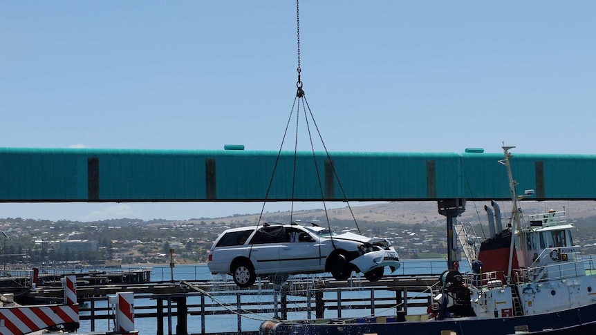 Car which had the bodies of a man and two children inside getting pulled from waters off Port Lincoln.