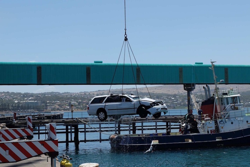 Car which had the bodies of a man and two children inside getting pulled from waters off Port Lincoln.