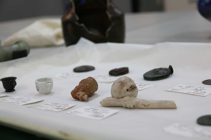 Tea cups, pipes and other artefacts from pre-1900s Melbourne.