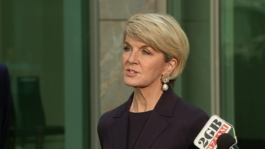 Former foreign minister Julie Bishop congratulates her successor, Marise Payne