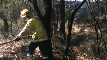The firefighter puts out hotspots