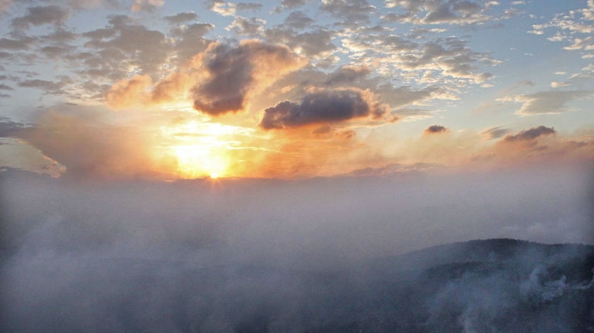 Smoke rises from a bushfire