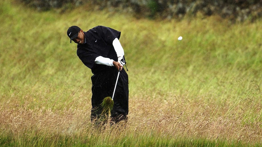 Tiger Woods hits out of the rough in the third round of the 2002 British Open at Muirfield