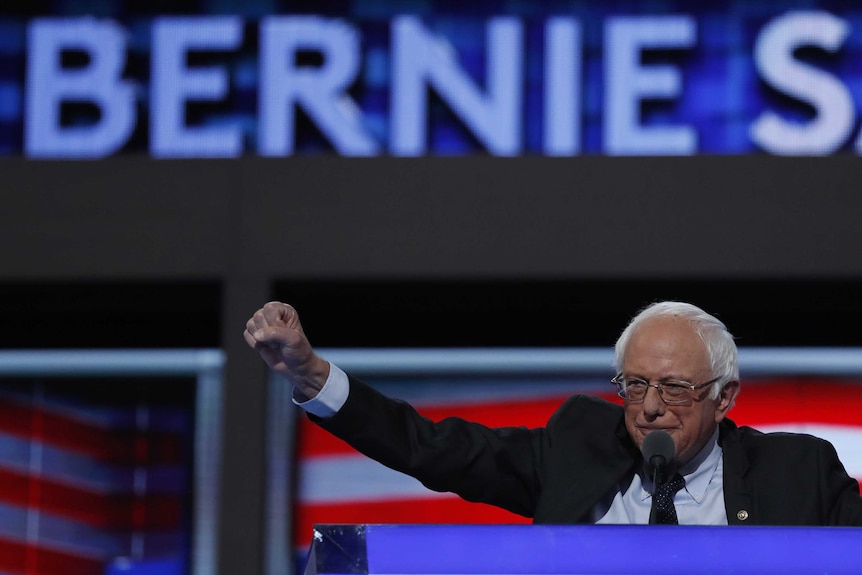 Former Democratic US presidential candidate Senator Bernie Sanders thrusts his fist