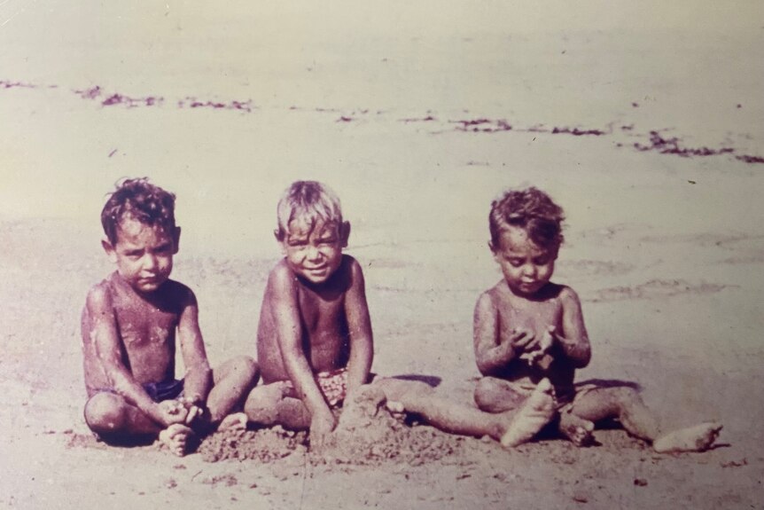 William Tilmouth with his brothers Bruce and Pat on the beach at Croker Island.