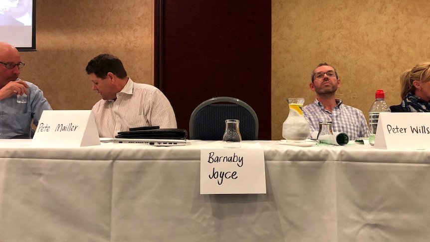 Barnaby Joyce's empty seat at a candidates forum in his New England electorate