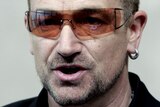 U2 lead singer Bono speaks during a news conference at the EC HQ in Brussels.