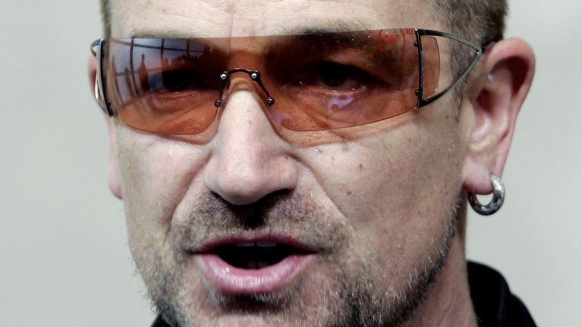 U2 lead singer Bono speaks during a news conference at the EC HQ in Brussels.