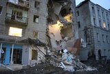 Building collapse from Russian missile