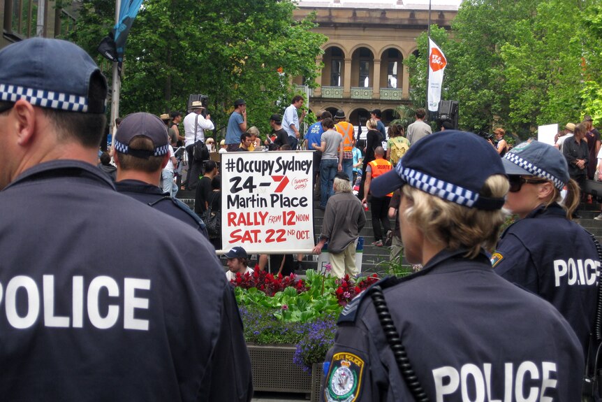 Police stand on guard during a Occupy protest at Martin Place in Sydney