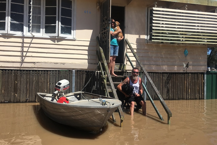 Depot Hill resident Mark Ford and his family were still surrounded by water on Saturday, despite the Fitzroy River receding.