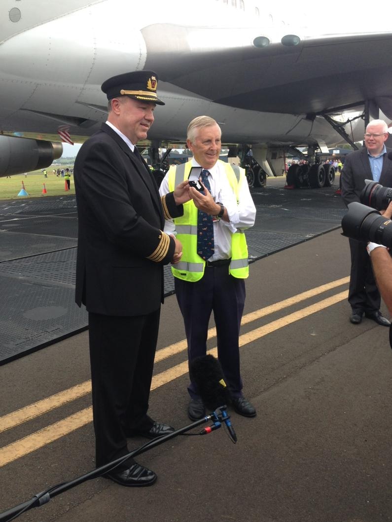 Pilot Greg Mathews hands over the keys of the City of Canberra to Bob De La Hunty