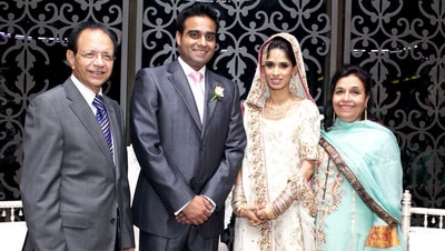 Shahnaz Qidwai (far right) who was killed in her Sydney waterfront property in 2012 and her husband Dr Khalid Qidwai (far left).