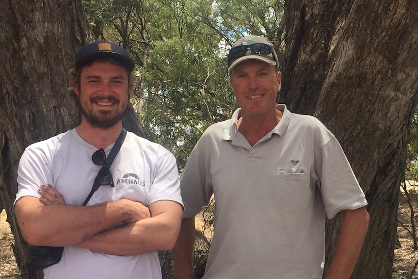 Brisbane artist Guido van Helten (left) with Brim Community Active Group president Shane Wardle.