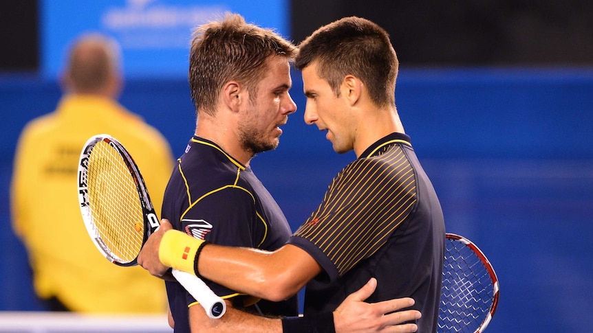 Epic encounter ... Novak Djokovic (R) embraces Stan Wawrinka after their 2013 classic