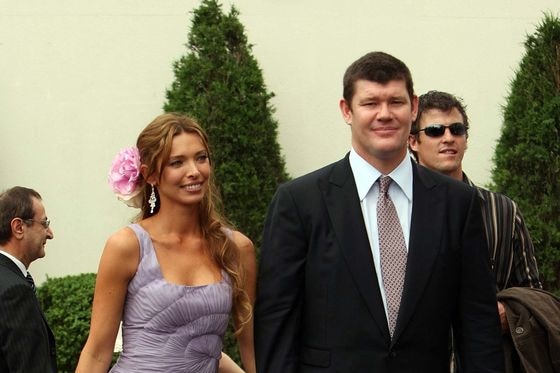 James Packer and wife Erica Baxter walk through Flemington race course