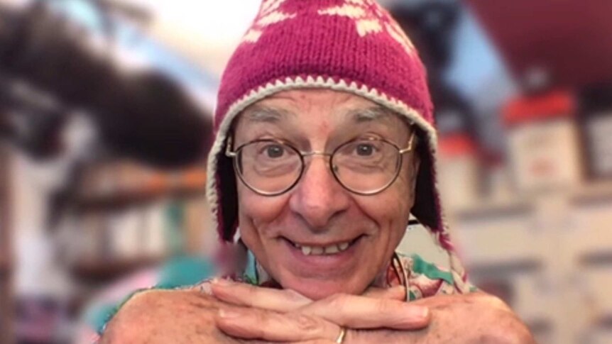 Dr karl wearing a beanie over skype with lucy smith