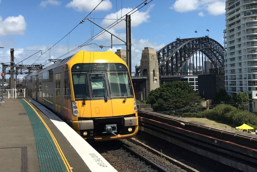 A train, with the Harbour Bridge in the background.