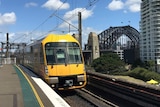 A train, with the Harbour Bridge in the background.