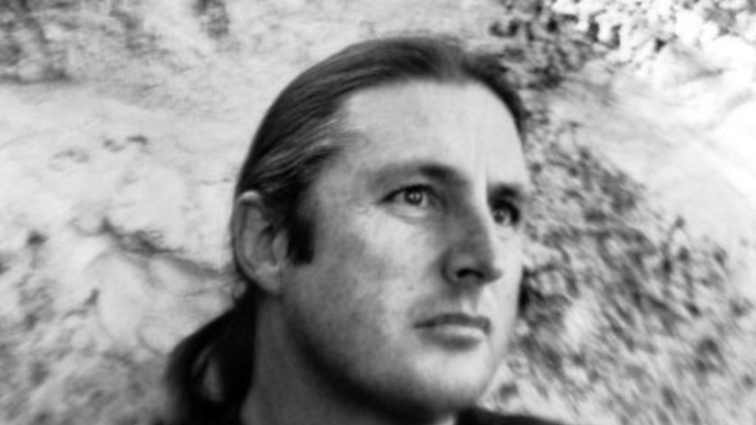 A close-up black-and-white photograph of Tim Winton