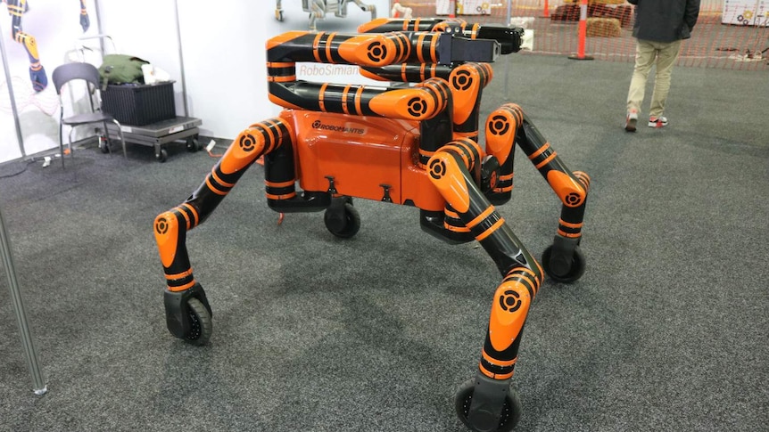 Orange and black robots with arms and legs