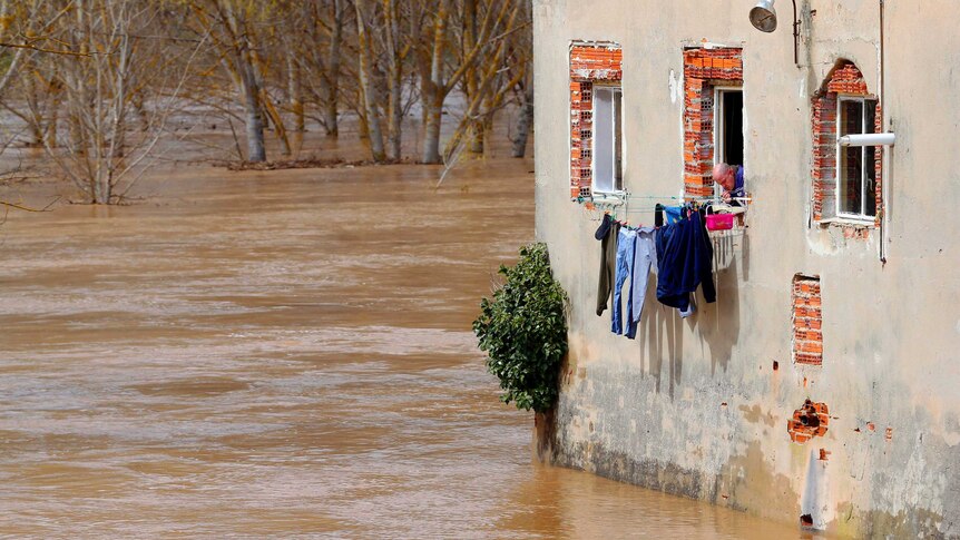 Floodwaters surround home in Spain.
