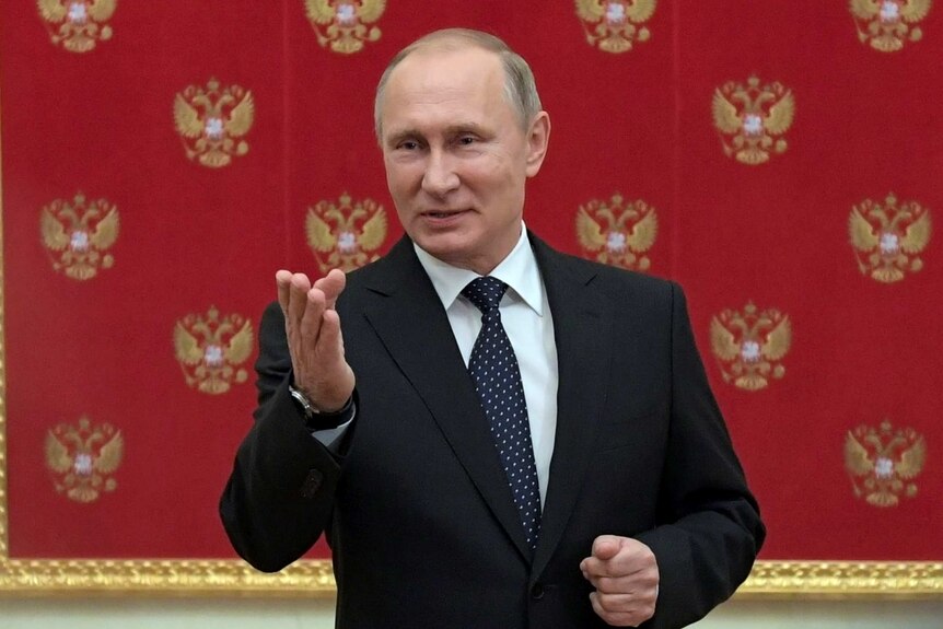 Russian President Vladimir Putin speaks during a meeting with journalists.