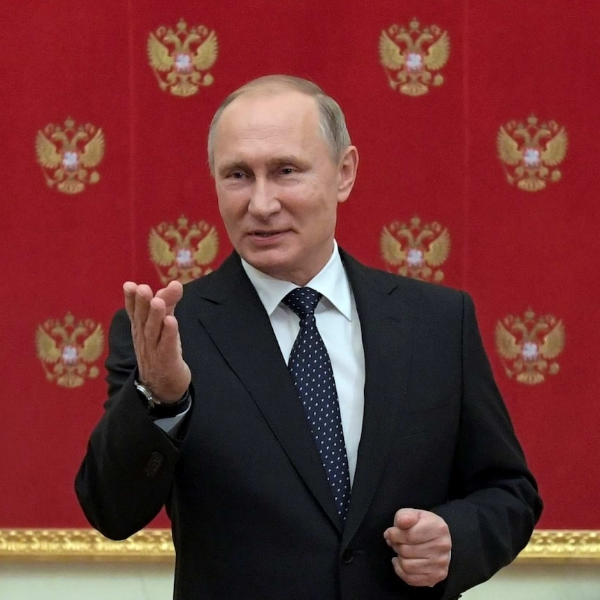 Russian President Vladimir Putin speaks during a meeting with journalists.