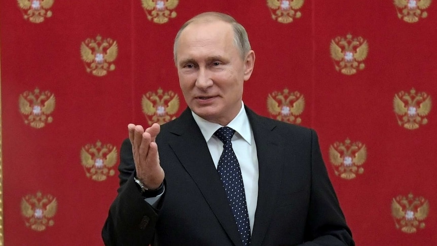 Russian President Vladimir Putin speaks during a meeting with journalists.