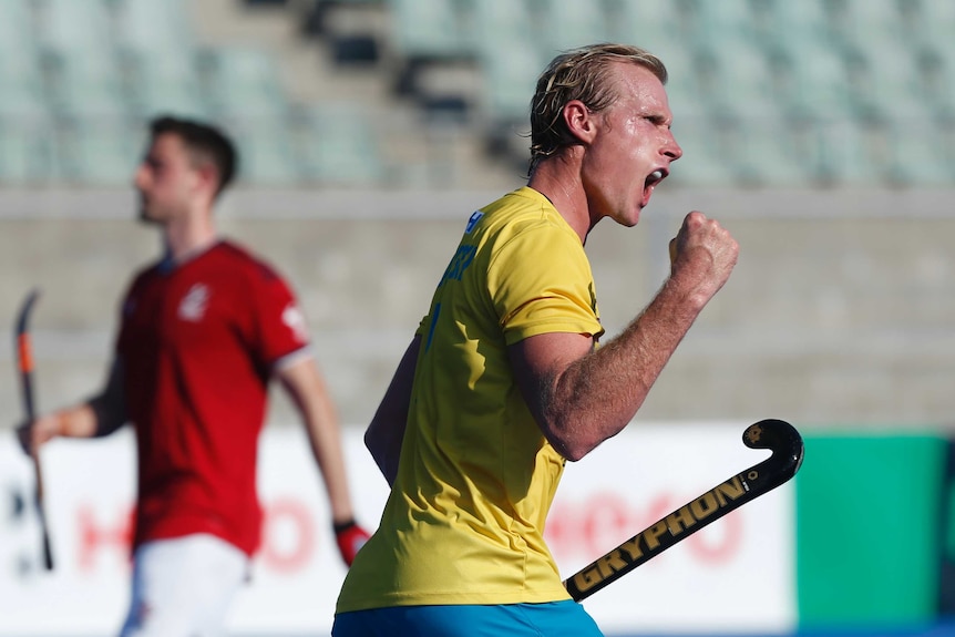 Aran Zalewski holding his fist in the air after a point score