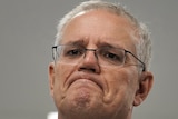 Scott Morrison looks down with a frown 