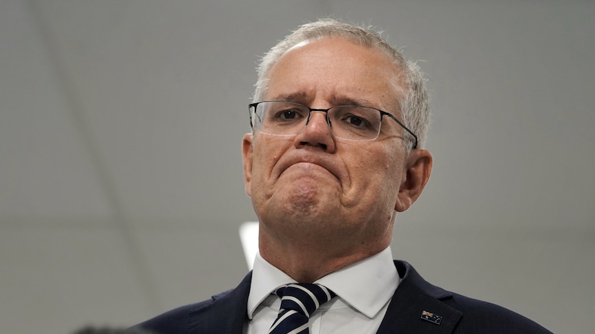 Scott Morrison looks down with a frown 