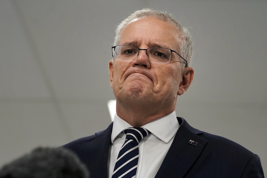 Scott Morrison looks down with a frown 