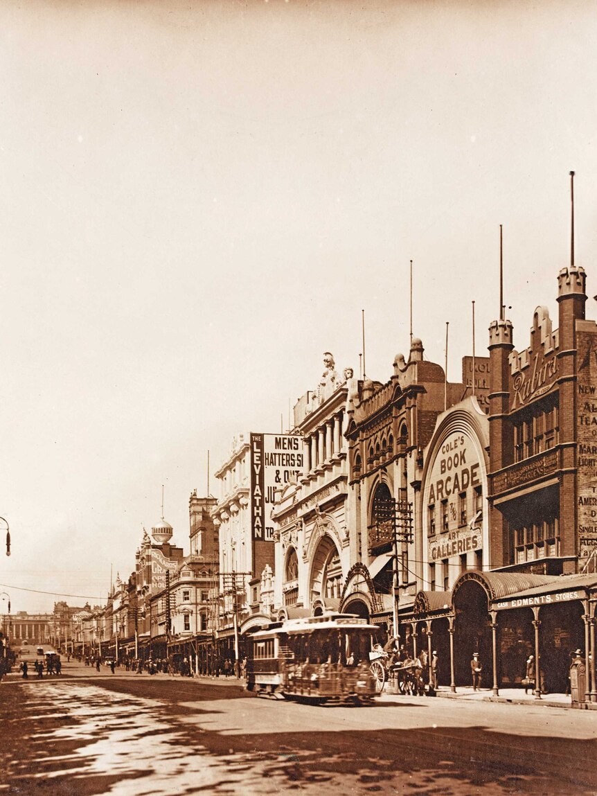 Black and white photo of the street view of Cole's Book Arcade from Bourke Street in Melbourne.