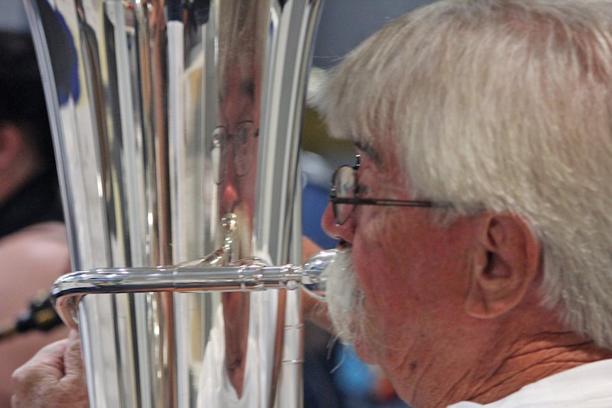 A man plays tuba for the Gold Coast City Wind Orchestra