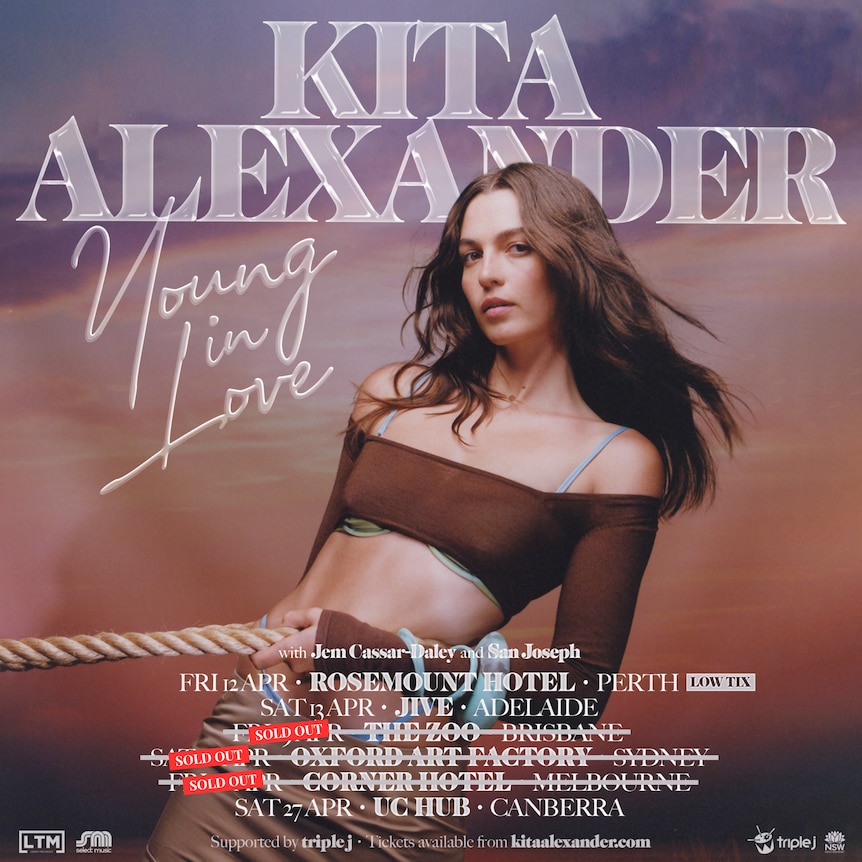 Poster for Kita Alexander's australian tour with kita in a brown cropped top holding onto a thick rope