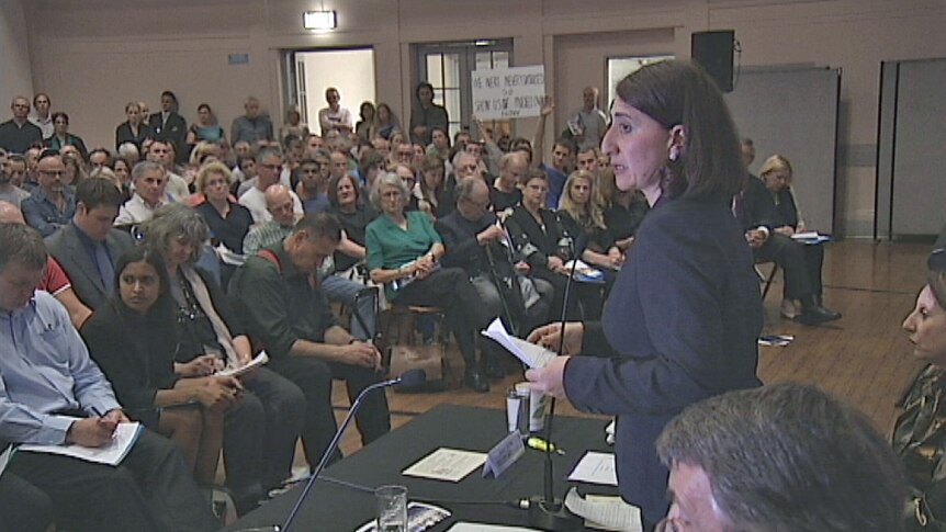 Gladys Berejiklian addresses and angry crowd