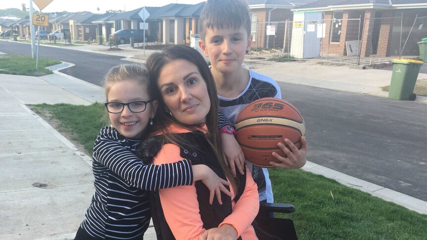 Shauna Cahill, who is sitting in a wheelchair, pictured with her children.