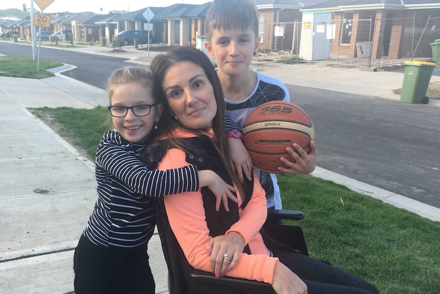 Shauna Cahill, who is sitting in a wheelchair, pictured with her children.