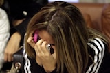 A Lebanese woman cries as she waits for news at the airport in Beirut