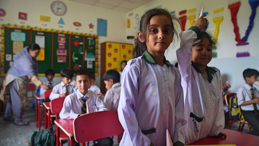 Two little girls in Swat classroom