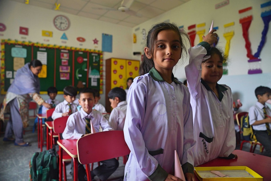 Two little girls in Swat classroom