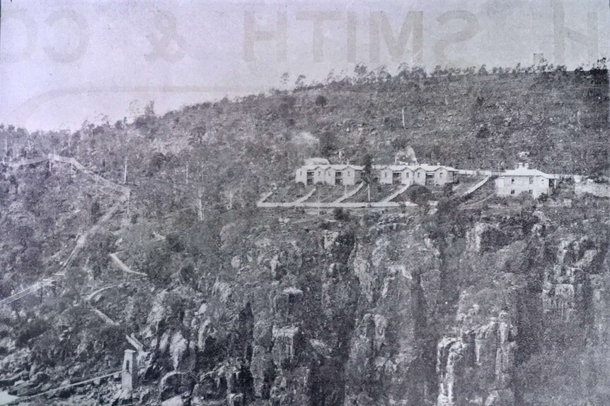 An old black and white newspaper photo of buildings on top of a cliff at Duck Reach in Launceston.