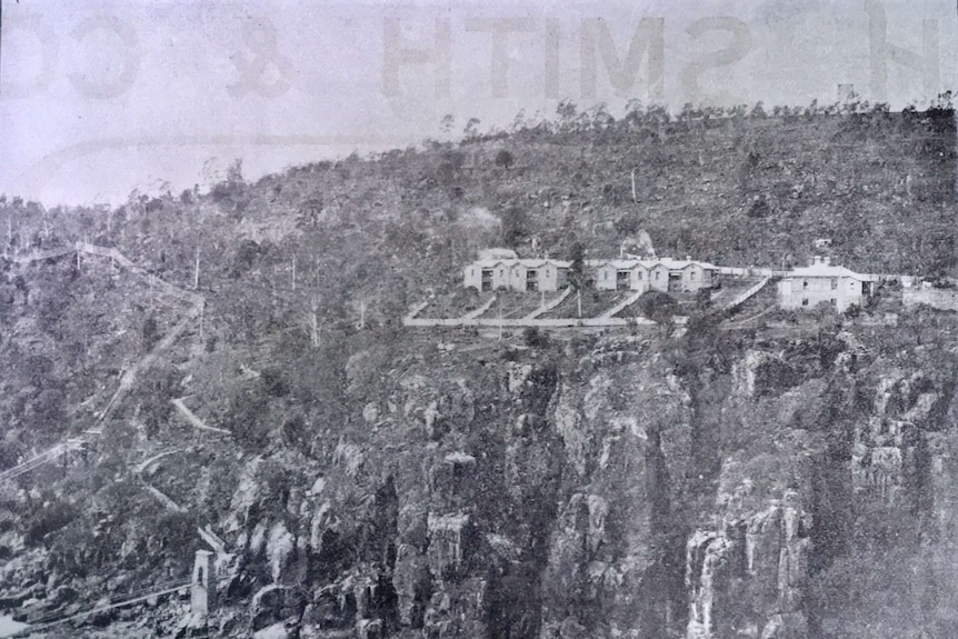 An old black and white newspaper photo of buildings on top of a cliff at Duck Reach in Launceston.