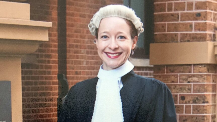 Sharna Clemmett in her legal wigs and robes standing out the NSW Supreme Court