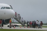 Asylum seekers leave Christmas Island.