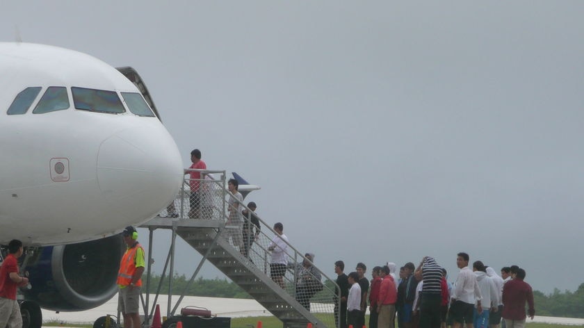 Asylum seekers leave Christmas Island.