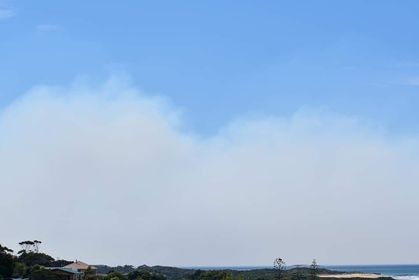 Smoke from a fire at St Helens billows towards the sea