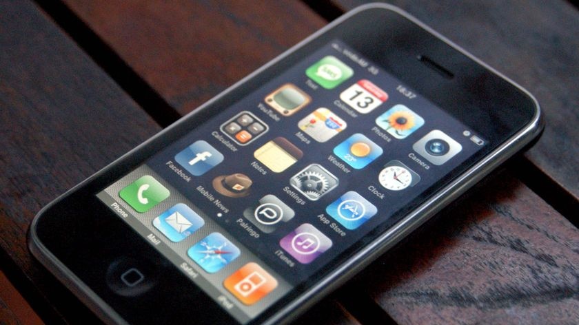 An Apple iPhone sits on a table, December 2008.