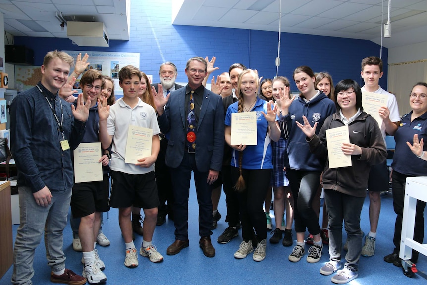 Canberra science teacher Geoff McNamara with his students.